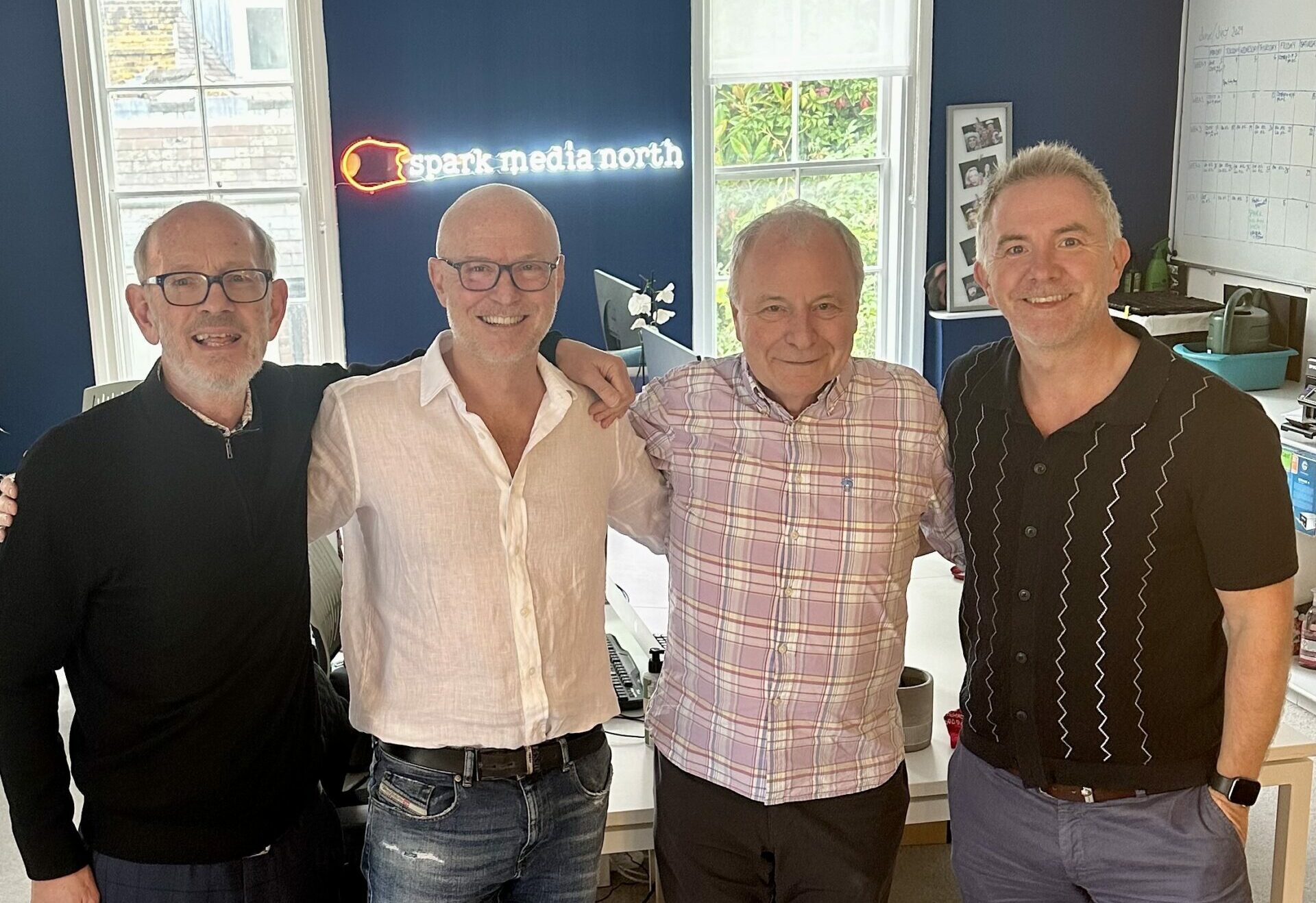 Image shows Founders Steve and Mark stood with Dr Barry Lynch and Tony McAvoy in the Spark Media offices